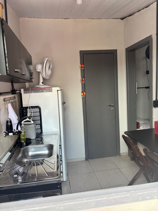 Fridge, stovetop, electric kettle, cookware/dishes/utensils