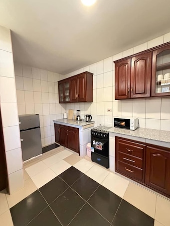 Full-size fridge, microwave, oven, stovetop. Singi Homes