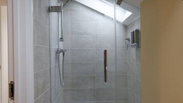 Shower, hair dryer, towels, soap