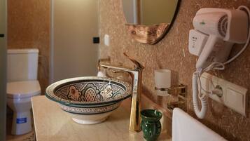 Luxury Suite, Air conditioning, Pool View | Bathroom | Separate bathtub and shower, hair dryer, towels, soap