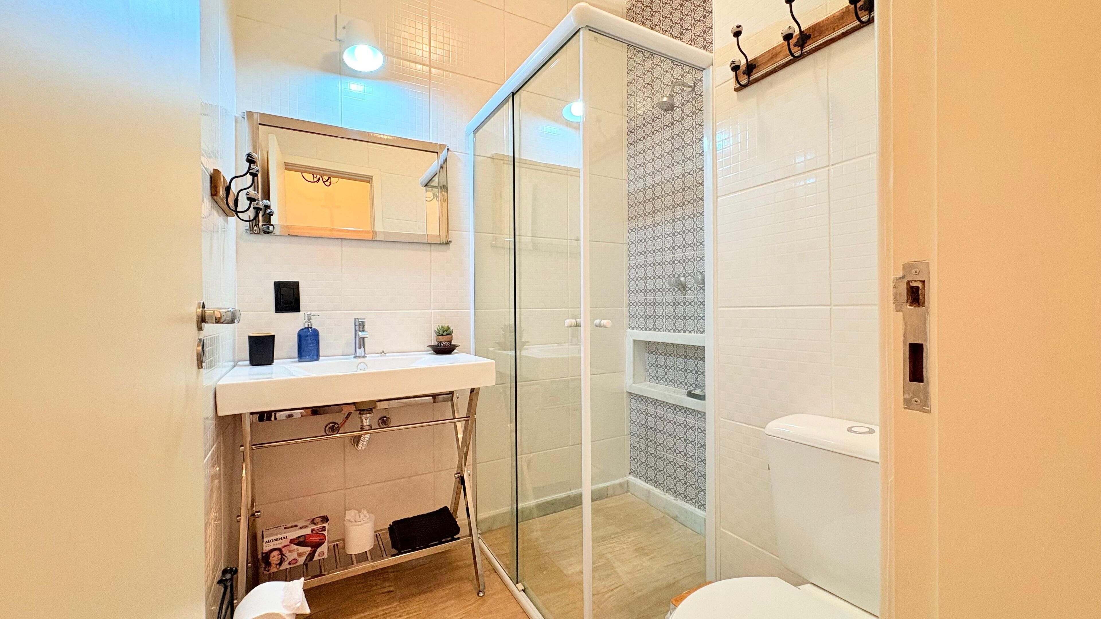 Shower, hair dryer, towels, soap