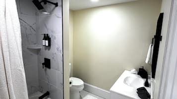 Hair dryer, towels, soap, toilet paper