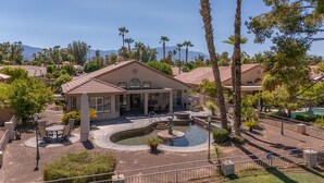 A residential property with a pool, patio, and mountain views. - Peaceful 3 bed 2 bath spacious home at Avondale Golf Club Palm Desert (Palm Desert)