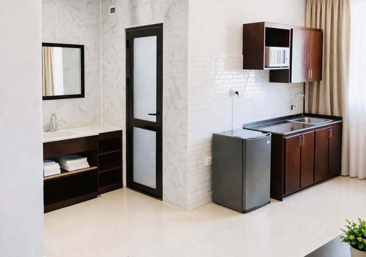 A modern kitchen with a refrigerator, a sink, and wooden cabinets.