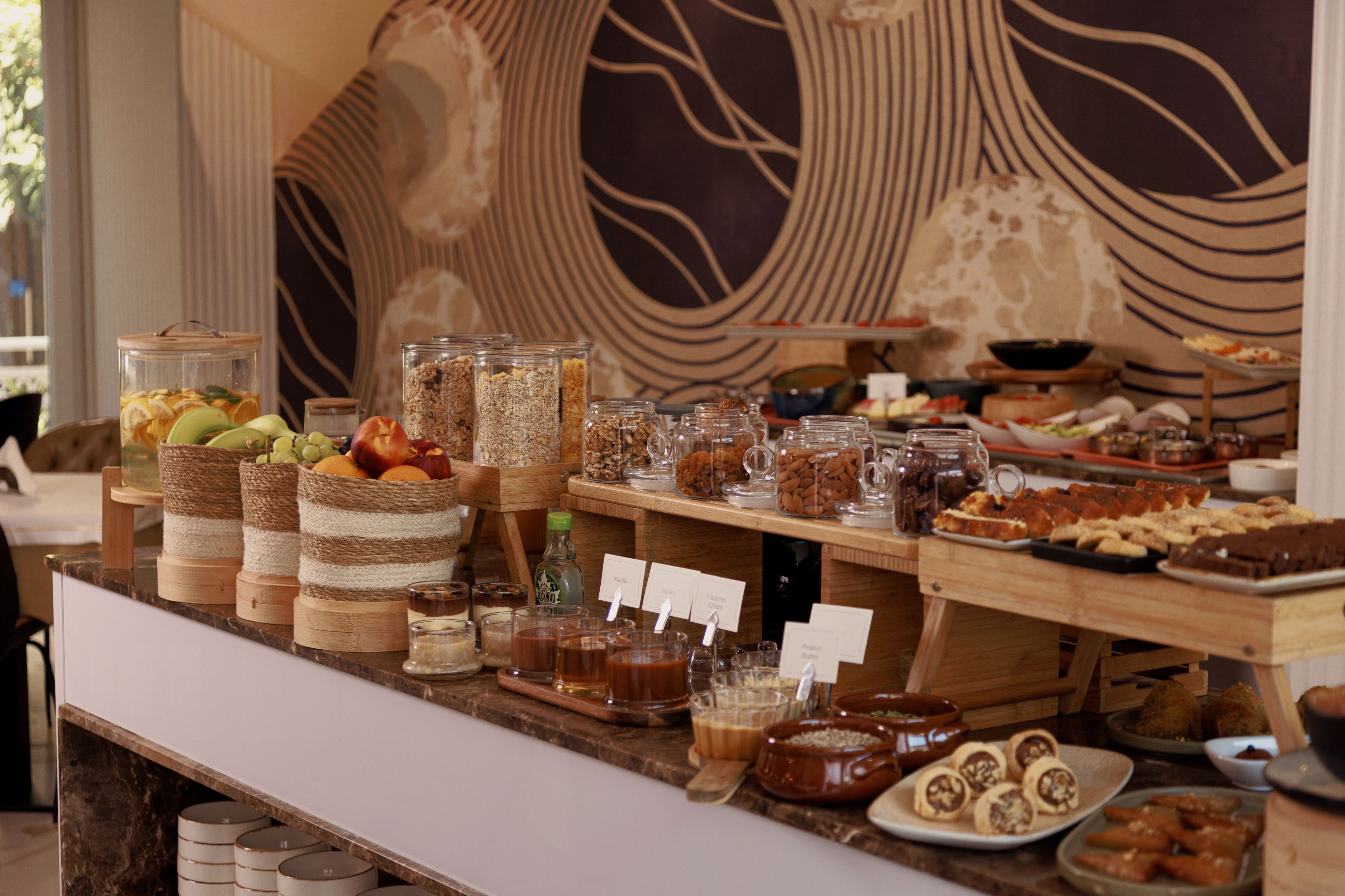 A buffet with various food items and beverages.