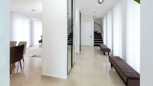 A modern interior with a hallway, a staircase, and seating area. - Villa Nova Berlin: Modern vacation home with plenty of space for relaxation and comfort (Berlin)