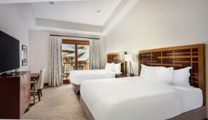 A hotel room with two beds, a desk, a TV, and a balcony with curtains. - PRESIDENTS WEEK: Feb 14-21, 2026 “SKI IN” HILTON: SUNRISE LODGE  3-bedroom Condo (Park City)