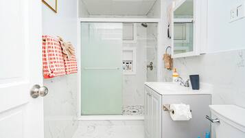 Shower, hair dryer, towels, soap