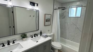 Hair dryer, towels, soap, toilet paper