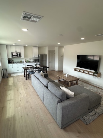 Living area. Cozy & Clean 2-bedroom Apartment -Brand New-