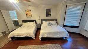 A bedroom with two beds, a ceiling fan, a rug, and a window with blinds. - Perfect and Spacious Hudson Valley Escape! (Cornwall)
