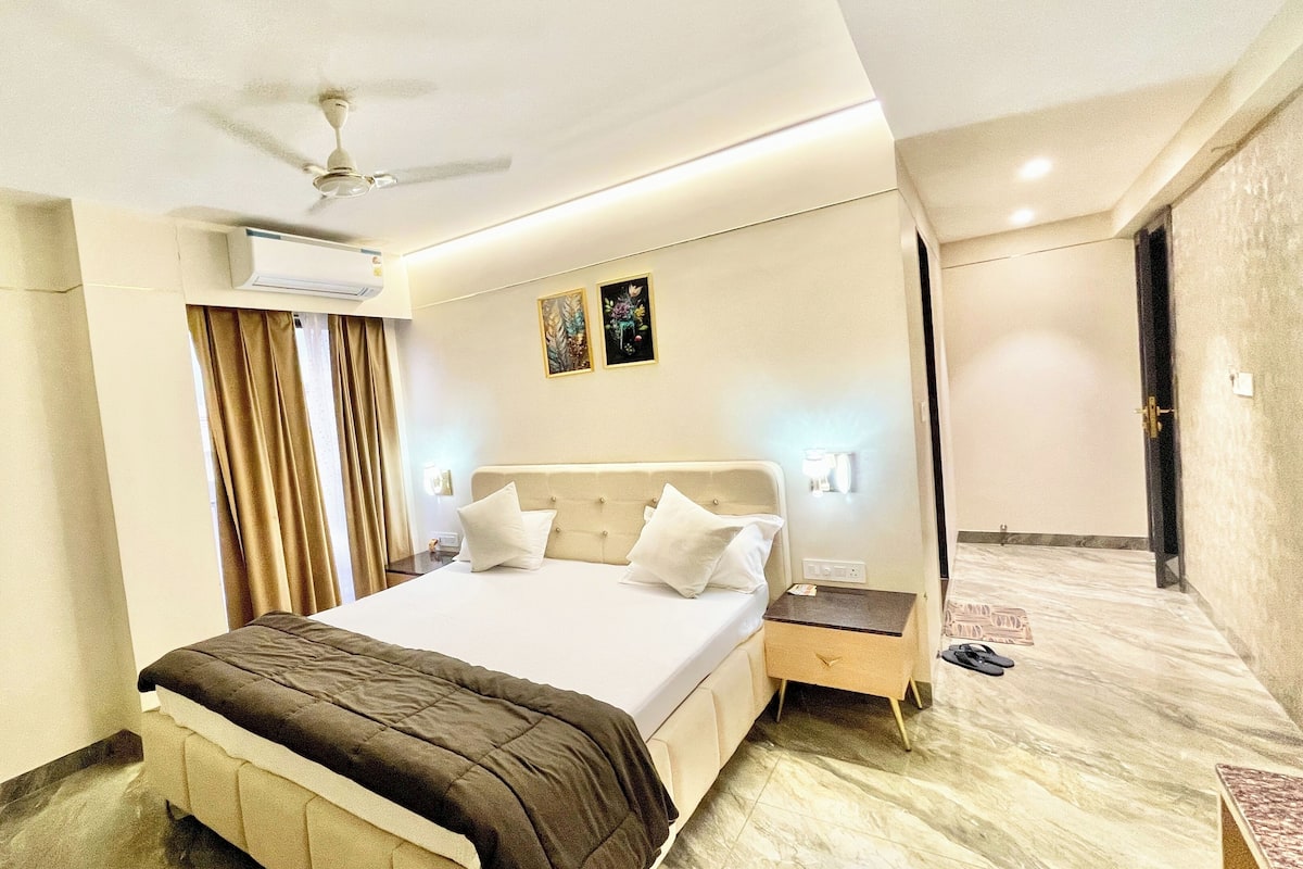 Premium bedding, desk, laptop workspace, soundproofing