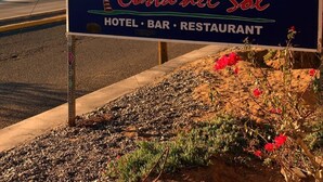 A sign for Costa del Sol, indicating it is a hotel, bar, and restaurant. - Costa del Sol Hotel & Sportfishing (Bahía de los Ángeles)