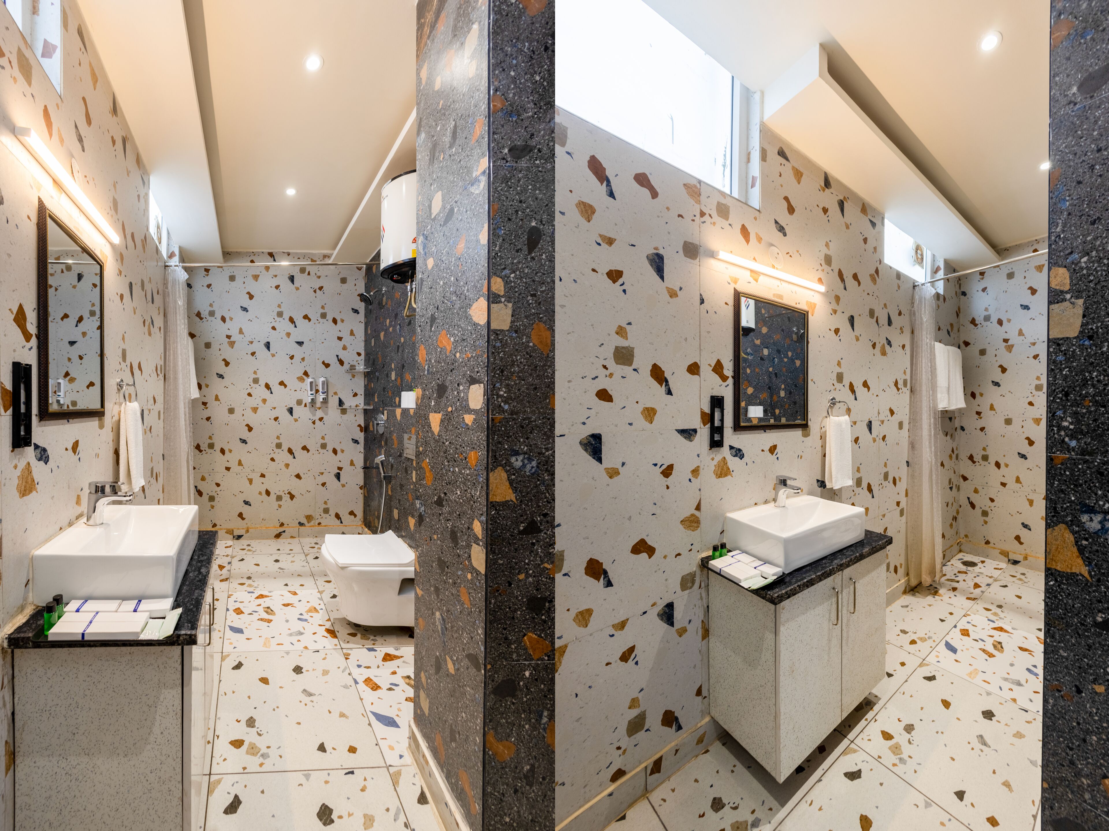 A modern bathroom with a freestanding bathtub, a toilet, and a sink with a countertop.