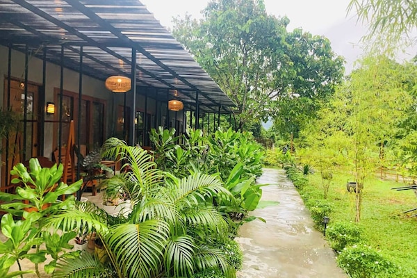 Deluxe Double Room, Garden View | Terrace/patio