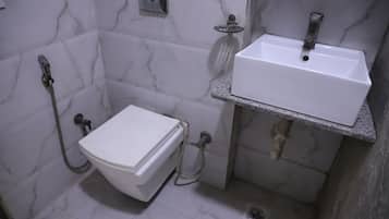 Basic Room, City View | Bathroom | Shower, free toiletries, towels