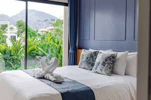 Premium bedding, desk, laptop workspace, iron/ironing board