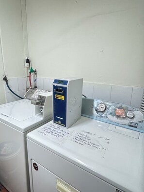 A laundry area with a washing machine, a dryer, and a water heater. Instructions are visible on the dryer. - Gangnam Female-Only mini room Gosiwon Seoul. Cozy ,quiet, Quick responses, safe (Seoul)