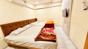 Deluxe Quadruple Room | Premium bedding, desk, laptop workspace, soundproofing - Hotel A Grand near All Main Places  (Ujjain)