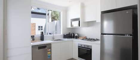 Coffee/tea maker, fridge, microwave, oven