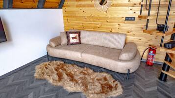 Suite – deluxe, bassengutsikt | Oppholdsområde