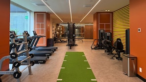 A gym with treadmills, weight machines, and a green turf area. - w Sophisticated 3BR in the Heart of San Rafael (Mexico City)