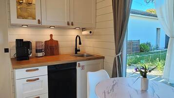 Fridge, microwave, stovetop, coffee/tea maker
