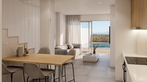 Ein modernes Wohnzimmer mit einem Holzesstisch, grauen Sofas und einem großen Fenster mit Blick auf einen Pool und Berge.