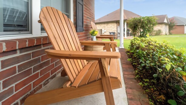 Two wooden Adirondack chairs and a small table outside a brick house with a window and a stone wall in the background. - Cozy & Quiet - CENTRAL Location - Master’s Retreat! (Augusta)