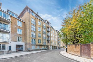 A multi-story residential building with a brick facade, large windows, and balconies. - Elmfield Way W9, Westbourne Park, Warrick Ave (London)
