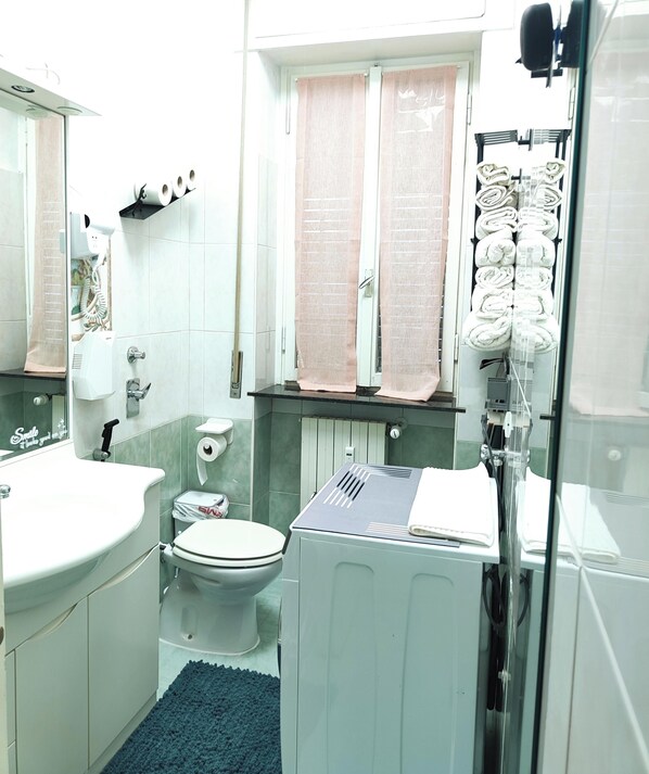 Shower, hair dryer, towels, soap
