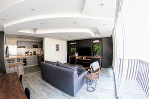 A modern apartment with a living room, kitchen, and dining area. - Renovated Condesa apt on Amsterdam: Modern & Cozy! (Ciudad de México)