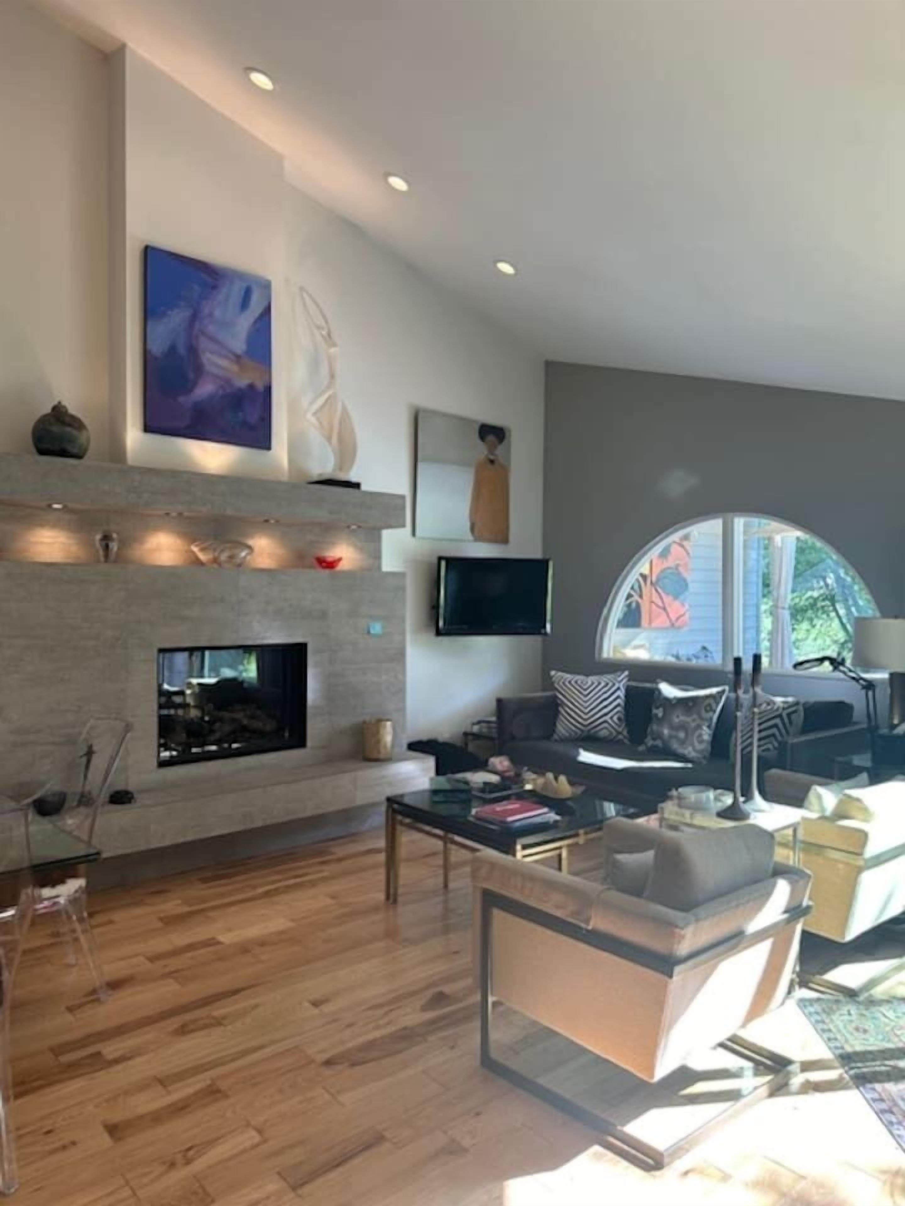 TV, fireplace, books