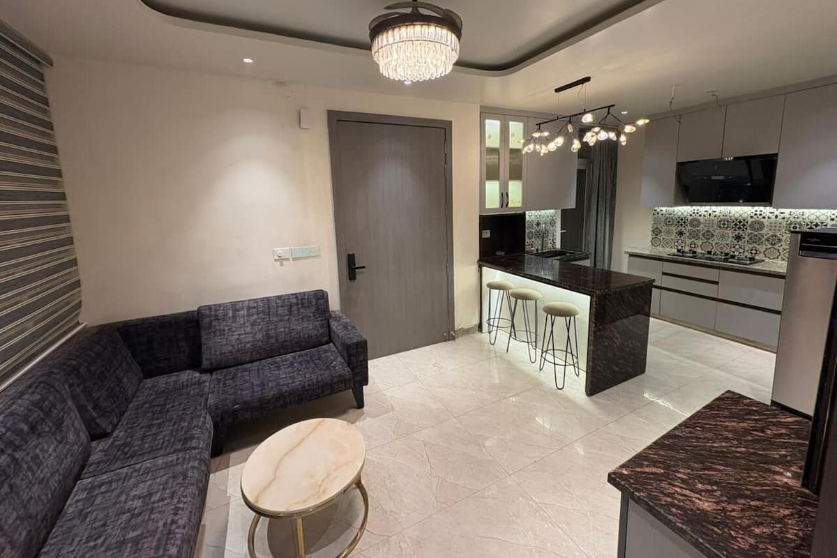 Premium Suite 2BHK Flat With Kitchen | Living area | 43-inch Smart TV with digital channels