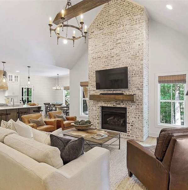 Living area - Hidden gem near Pickwick Lake. Fire pit, forest, and modern comfort. (Counce)