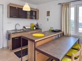 Family Apartment, Sea View | Iron/ironing board, free WiFi