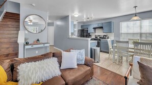 A modern apartment with a living room, kitchen, and dining area. - Cozy 3BR Duplex in Prime Austin | Near Downtown (Austin)