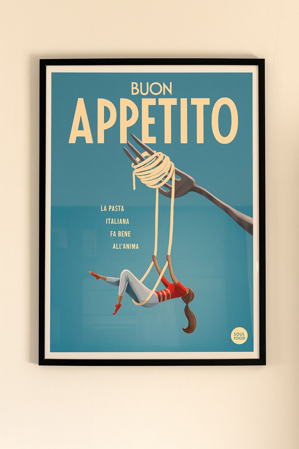 A framed artwork titled "BUON APPETITO" with a figure of a person tied to a fork against a blue background.