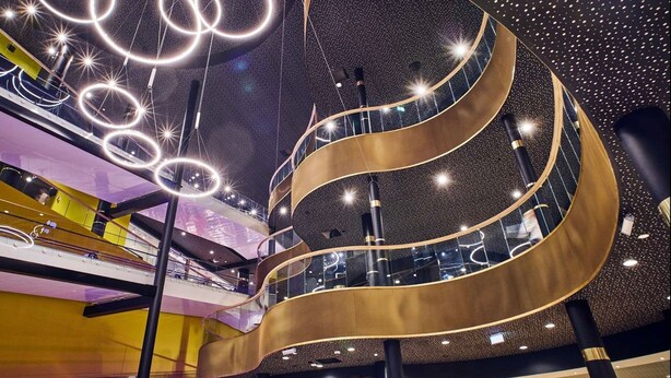 A multi-level atrium with a modern design, featuring a central spiral staircase and illuminated circular light fixtures. - Beautiful ocean and fjord view short distance to Bergen (Vestland)