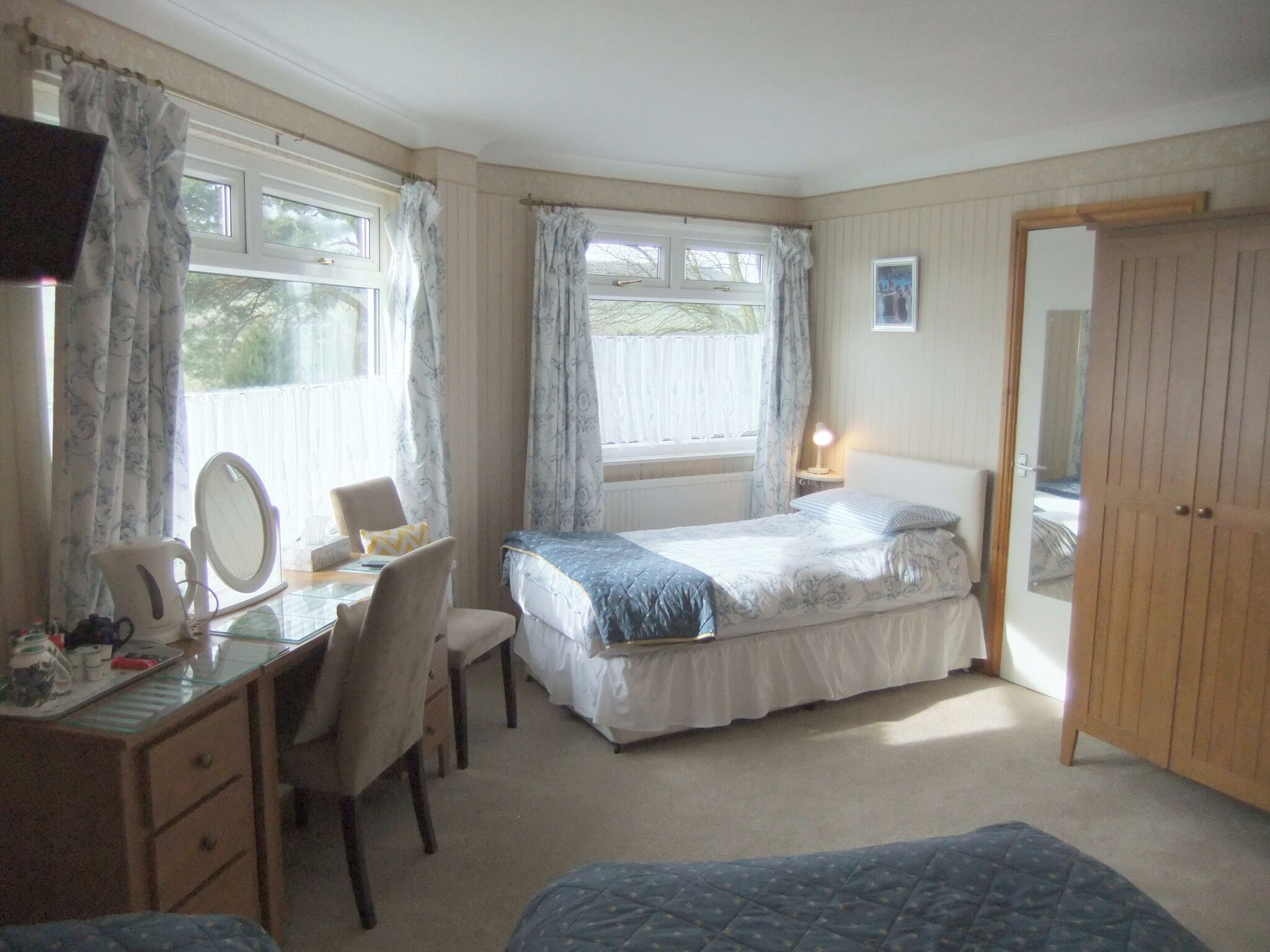 Basic Triple Room, Garden View | Desk, laptop workspace, blackout drapes, iron/ironing board