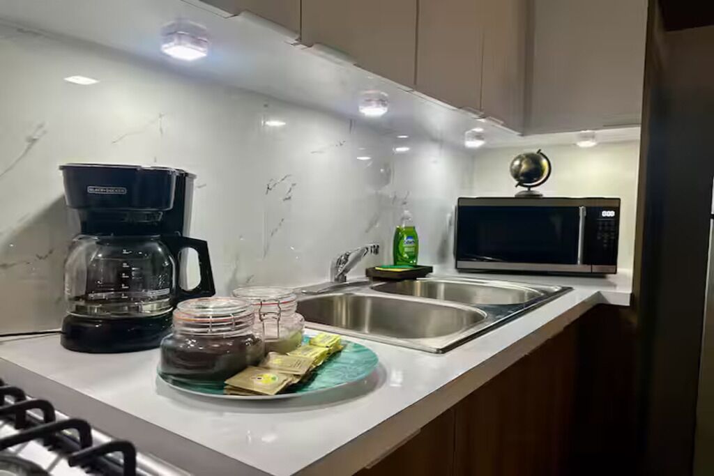 Fridge, microwave, stovetop, coffee/tea maker