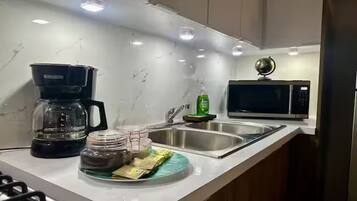 Fridge, microwave, stovetop, coffee/tea maker