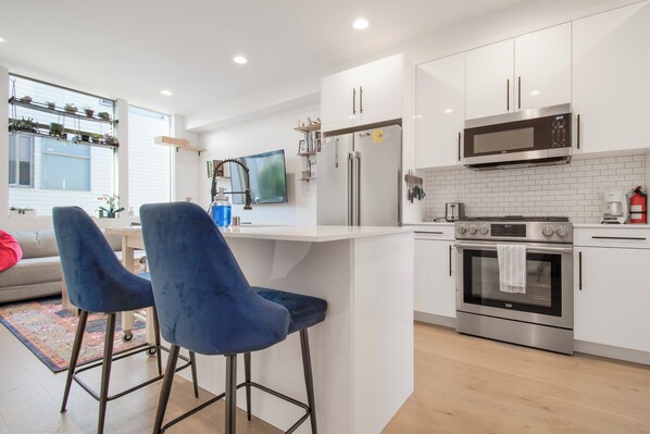 Fridge, microwave, oven, stovetop - Heart of Ballard: Modern, Pet-Friendly Townhome Walkable to Dining and Market! (Seattle)