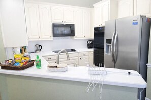 Fridge, microwave, oven, stovetop - DFW Family Fun Retreat Pool Table Air Hockey Arcade Game Work Space BBQ Firepit (North Richland Hills)