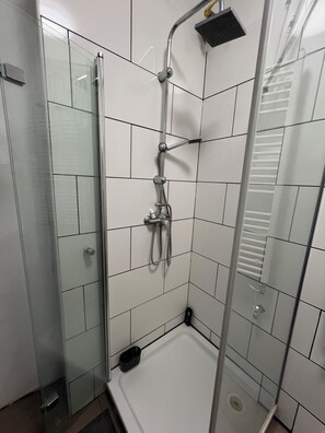 Shower, towels, soap, toilet paper