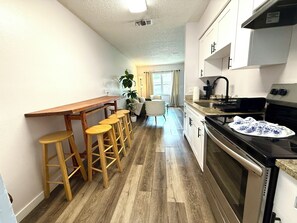 Fridge, microwave, oven, stovetop - Spacious 2BR Tampa Bay Apartment near Beaches, Arenas & Airport Minutes Away (Pinellas Park)