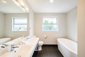 Shower, hair dryer, towels, shampoo