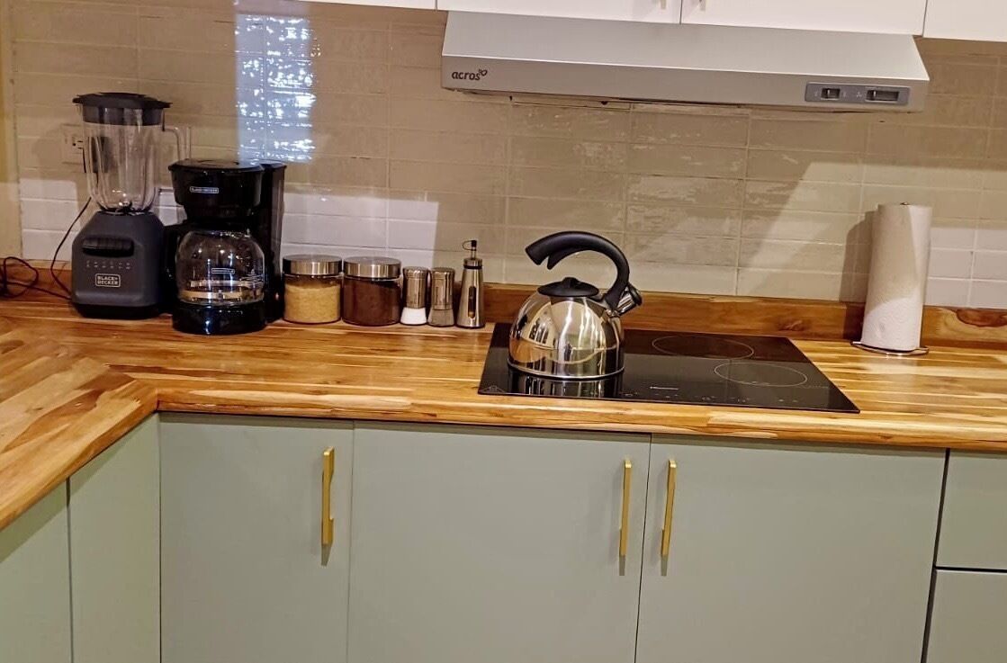 Fridge, microwave, coffee/tea maker, cookware/dishes/utensils