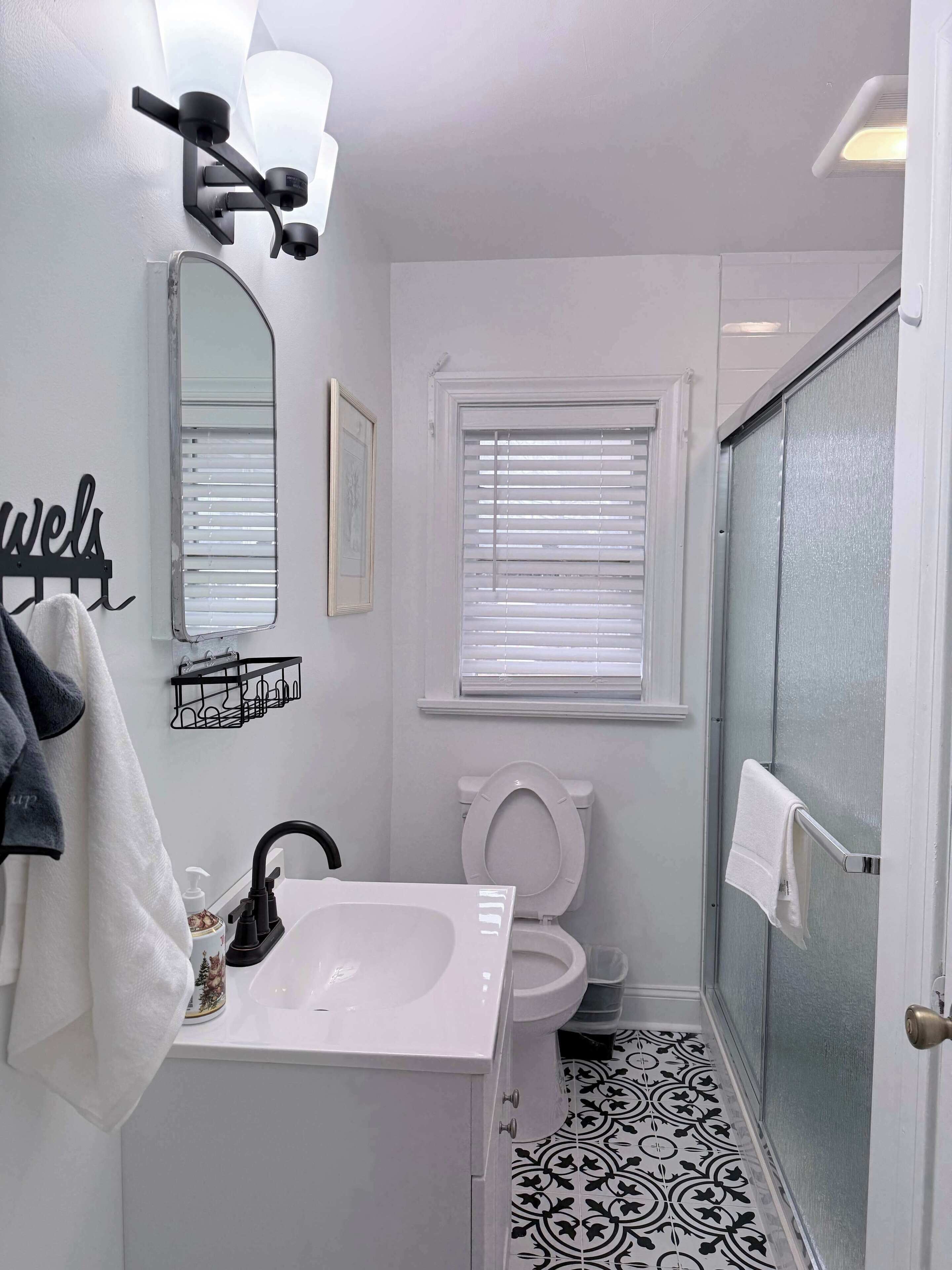 Shower, hair dryer, towels, shampoo