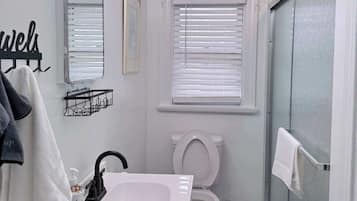 Shower, hair dryer, towels, shampoo